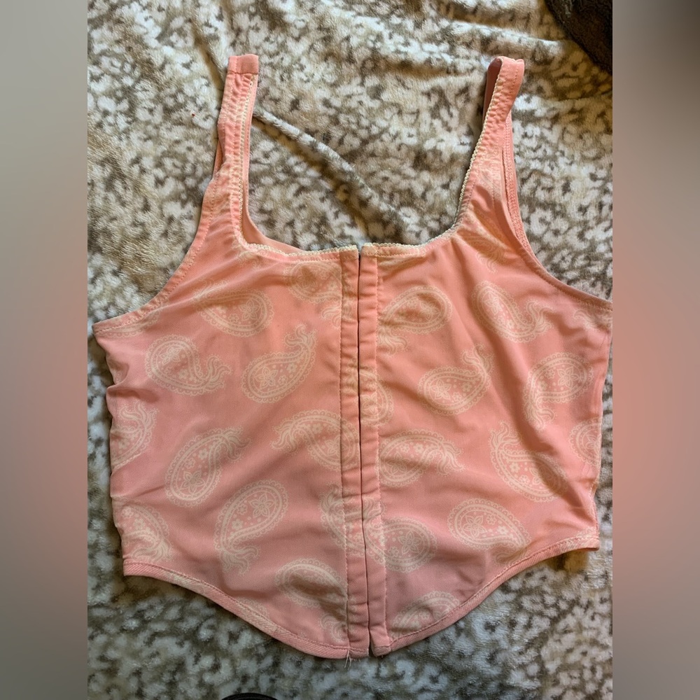 Women’s pink corset kind of top. Size large